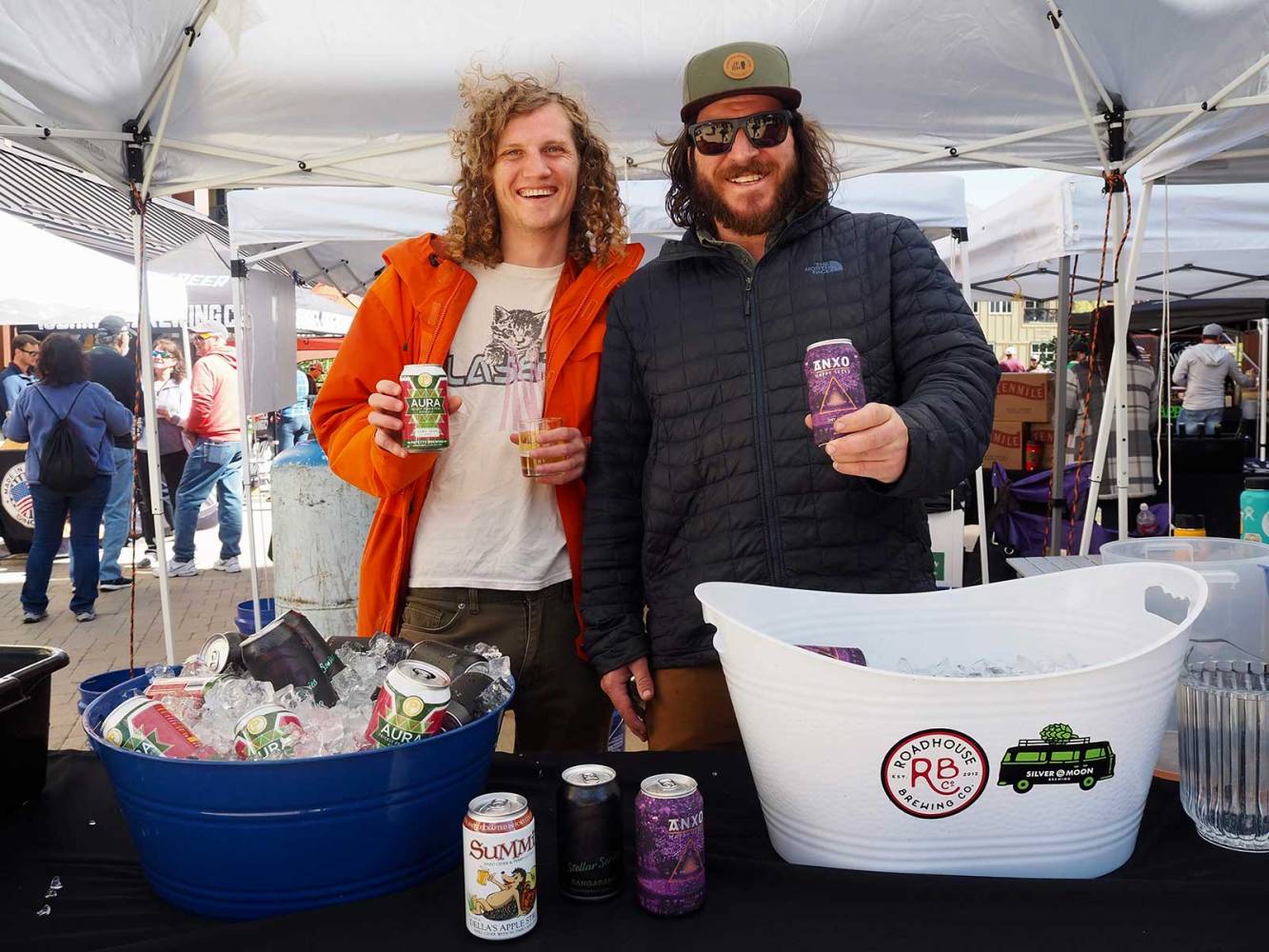 Strings Ciders Sours men under tent